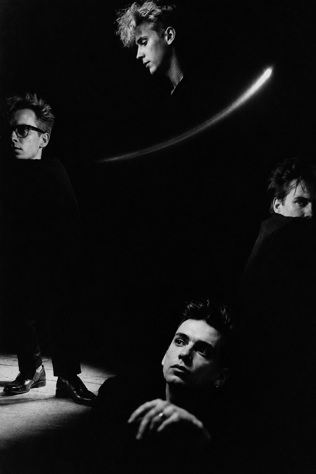 Depeche Mode in 1987 emerging as four fragments from a black void
